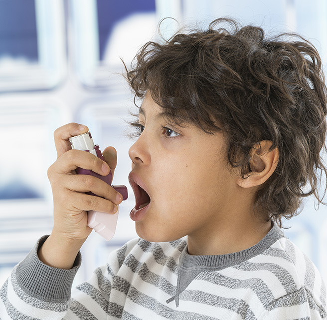 Child using inhaler for Asthma treatment